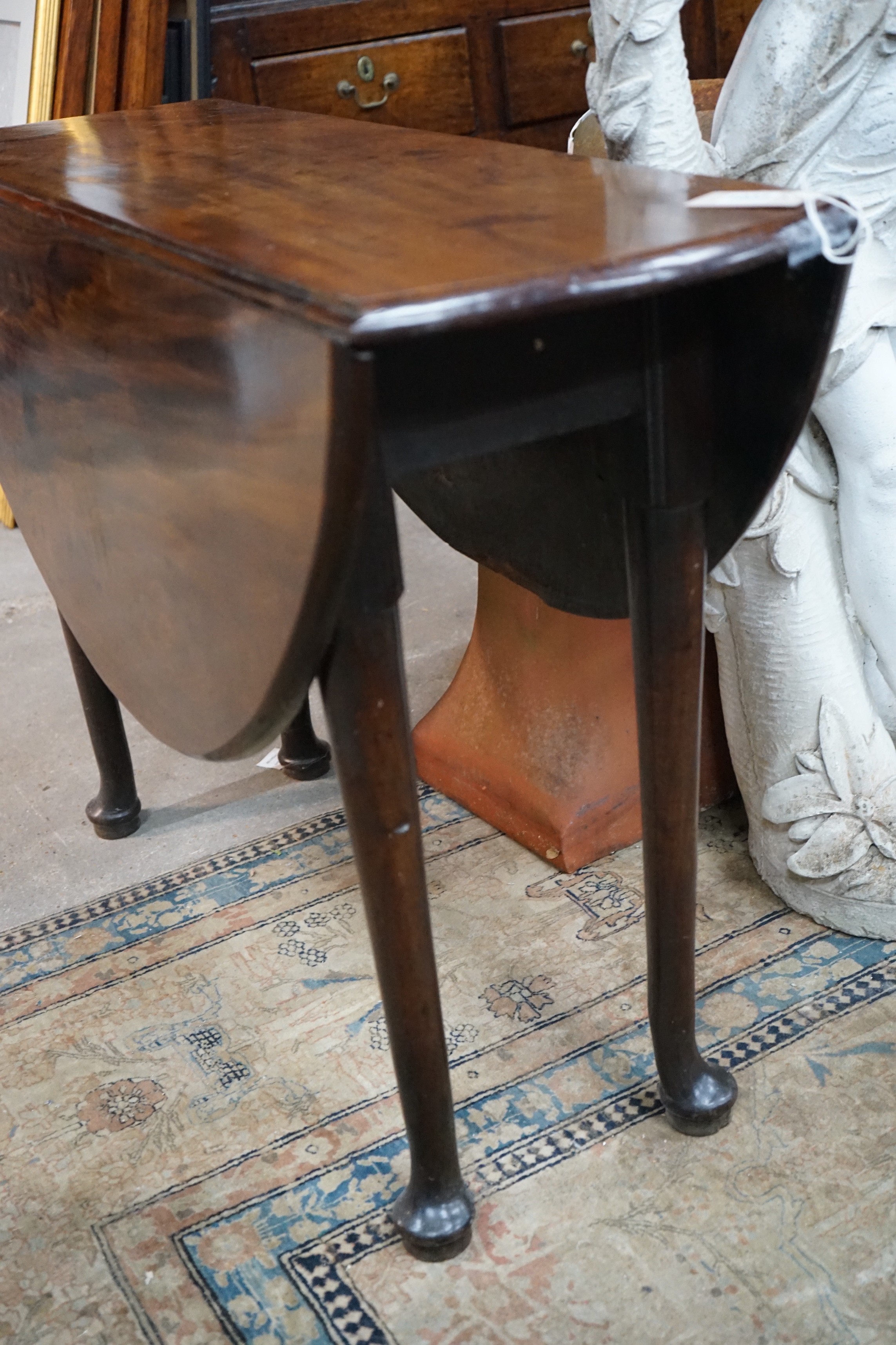 A George III mahogany padfoot drop leaf dining table, length 108cm extended, width 99cm, height 71cm